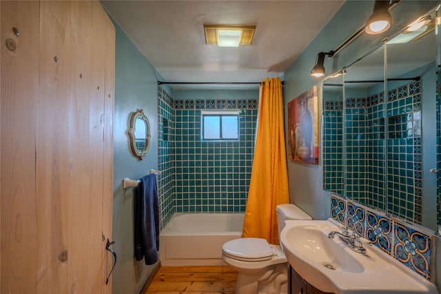 full bath with vanity, shower / bathtub combination with curtain, toilet, and wood finished floors
