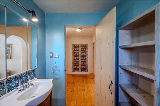 bathroom with wood-type flooring and vanity