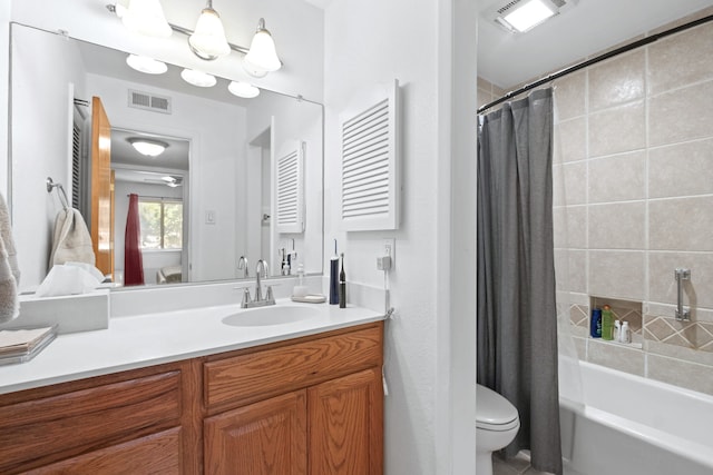 full bathroom featuring vanity, shower / tub combo with curtain, toilet, and visible vents