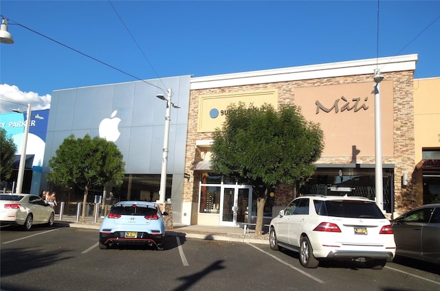 view of property featuring uncovered parking