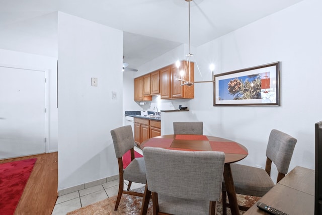 dining space with light tile patterned floors and baseboards