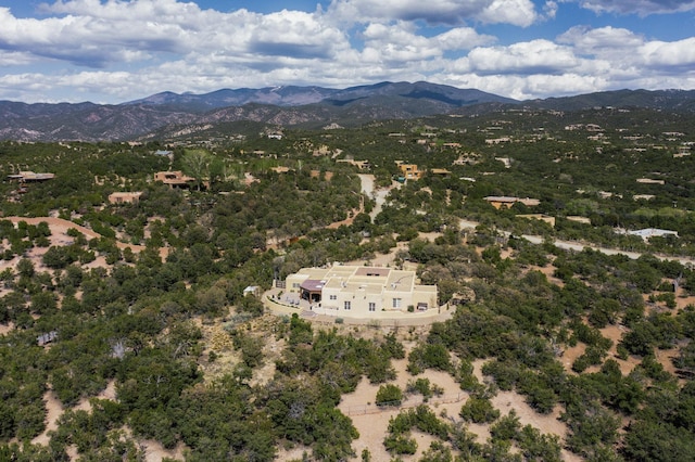 birds eye view of property featuring a mountain view
