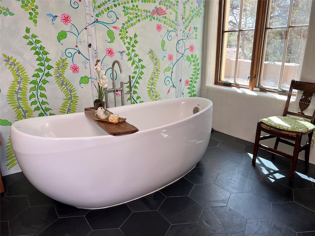 full bathroom featuring a freestanding bath