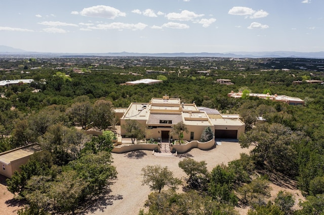 drone / aerial view featuring a forest view
