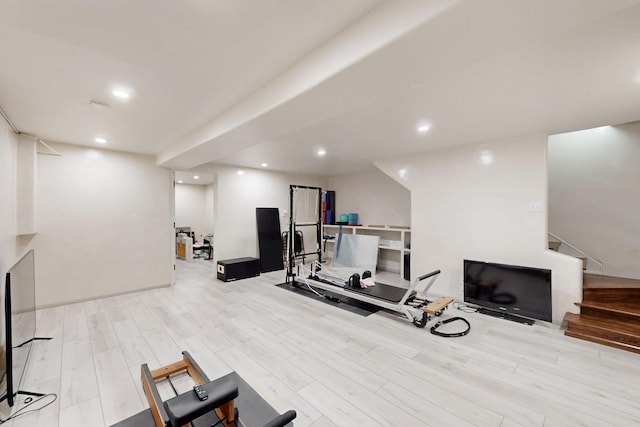 workout area featuring recessed lighting and wood finished floors