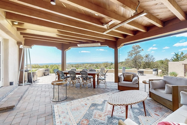 view of patio / terrace with an outdoor living space and outdoor dining area
