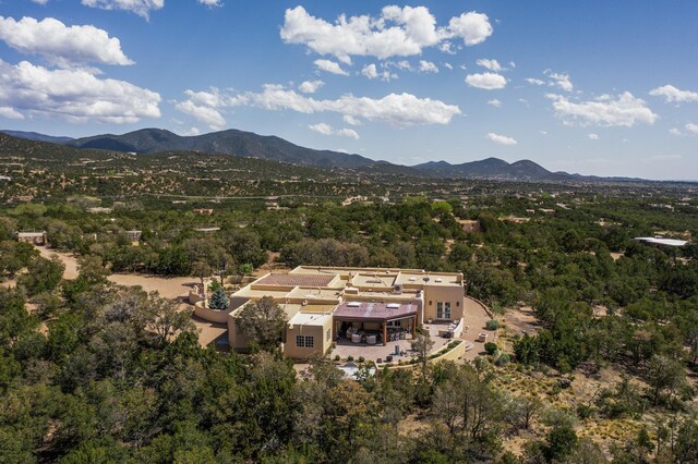 birds eye view of property with a mountain view