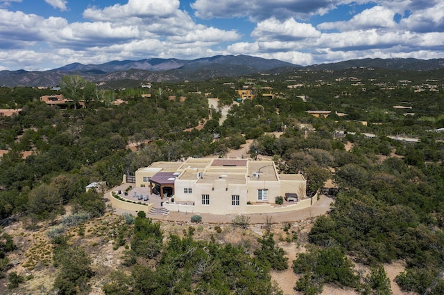 birds eye view of property with a mountain view