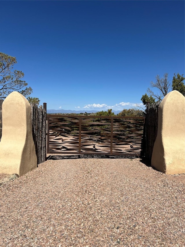 view of gate featuring fence