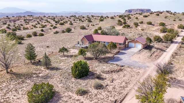 aerial view with a desert view, a mountain view, and a rural view
