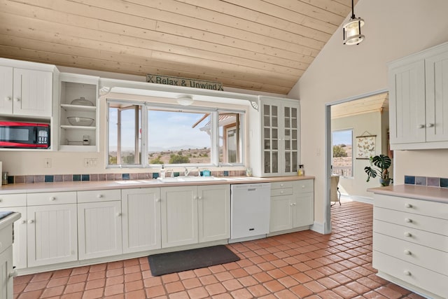 kitchen featuring white cabinets, white dishwasher, light countertops, lofted ceiling, and wood ceiling