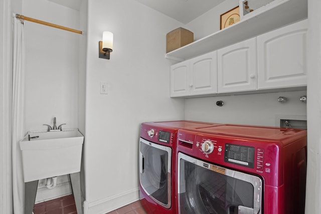laundry area with cabinet space, baseboards, tile patterned floors, and washer and dryer