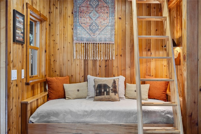 bedroom with wooden walls
