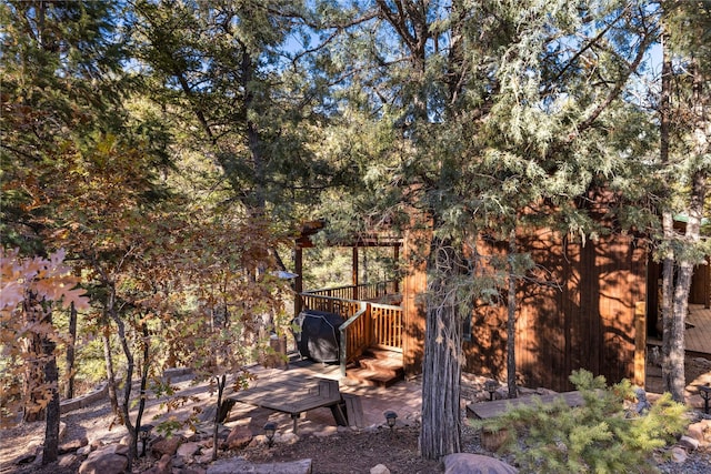 view of yard with a wooden deck