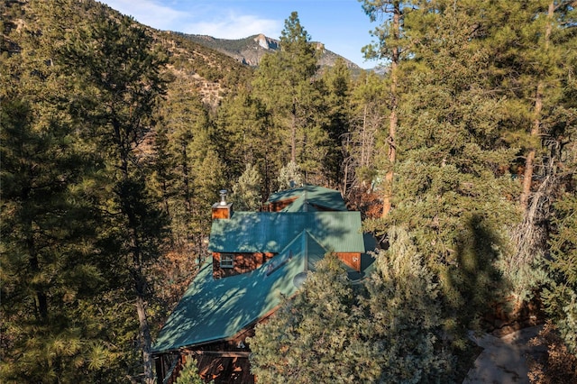 bird's eye view featuring a view of trees and a mountain view