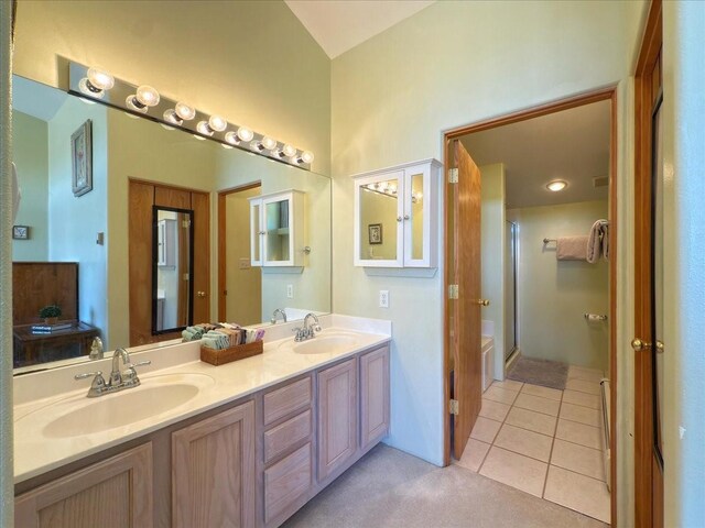4621 Esperanza, Los Alamos, NM 87544 - bathroom featuring a shower with shower door, double vanity, a sink, and tile patterned flooring