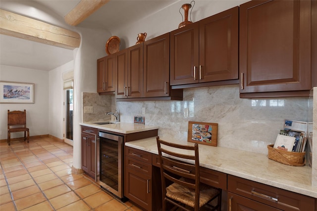3101 Old Pecos Trl Unit 627, Santa Fe, NM 87505 - kitchen featuring a sink, wine cooler, light tile patterned flooring, and decorative backsplash