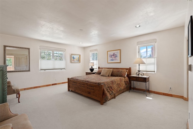 3101 Old Pecos Trl Unit 627, Santa Fe, NM 87505 - bedroom featuring carpet floors, baseboards, and multiple windows
