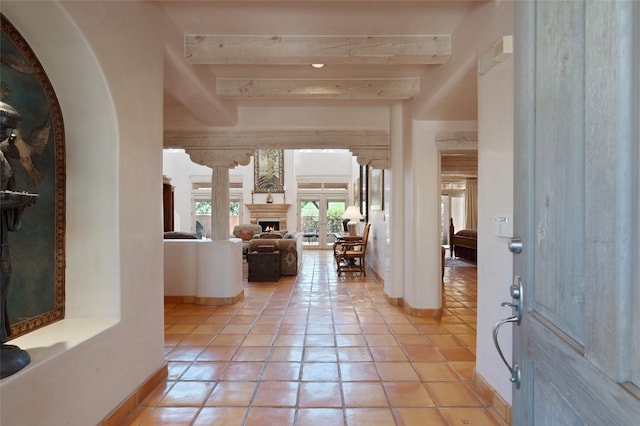 3101 Old Pecos Trl Unit 627, Santa Fe, NM 87505 - foyer with baseboards, beamed ceiling, and light tile patterned flooring