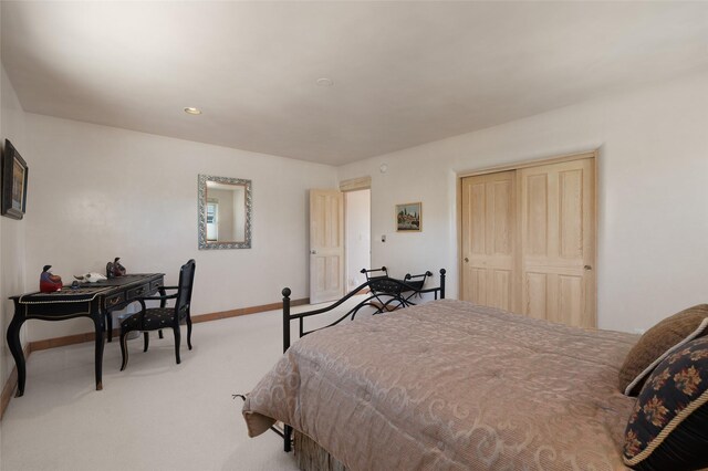 3101 Old Pecos Trl Unit 627, Santa Fe, NM 87505 - carpeted bedroom with a closet and baseboards