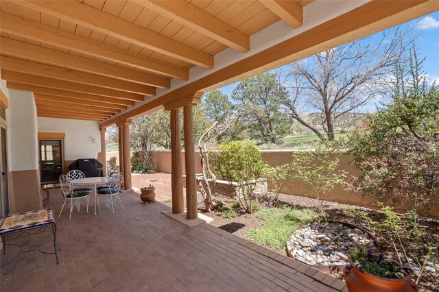 3101 Old Pecos Trl Unit 627, Santa Fe, NM 87505 - view of patio with outdoor dining space and a fenced backyard