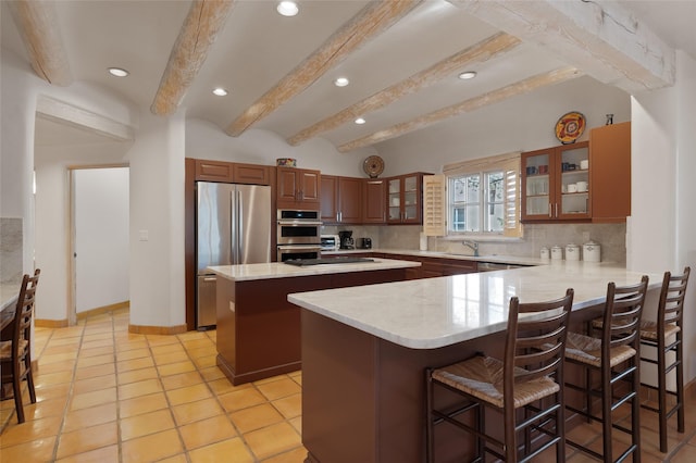 3101 Old Pecos Trl Unit 627, Santa Fe, NM 87505 - kitchen with recessed lighting, a sink, decorative backsplash, a kitchen island, and appliances with stainless steel finishes