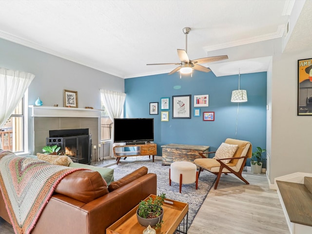 505 Oppenheimer Dr Unit 1304, Los Alamos, NM 87544 - living area featuring crown molding, a fireplace, light wood-style flooring, a ceiling fan, and baseboards