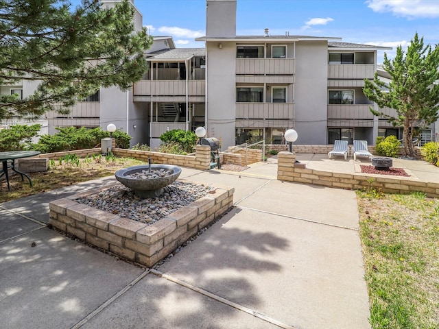 505 Oppenheimer Dr Unit 1304, Los Alamos, NM 87544 - exterior space with a patio area and an outdoor fire pit