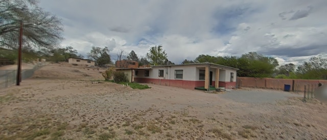 back of property with fence