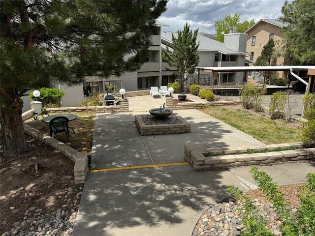 exterior space featuring an outdoor fire pit