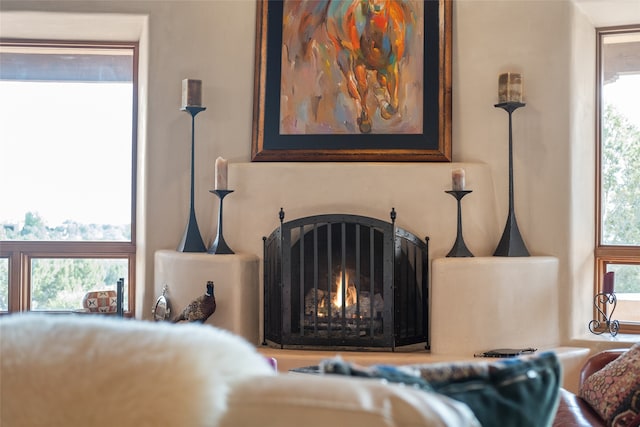 35 Sage Cir, Santa Fe, NM 87506 - room details featuring a warm lit fireplace
