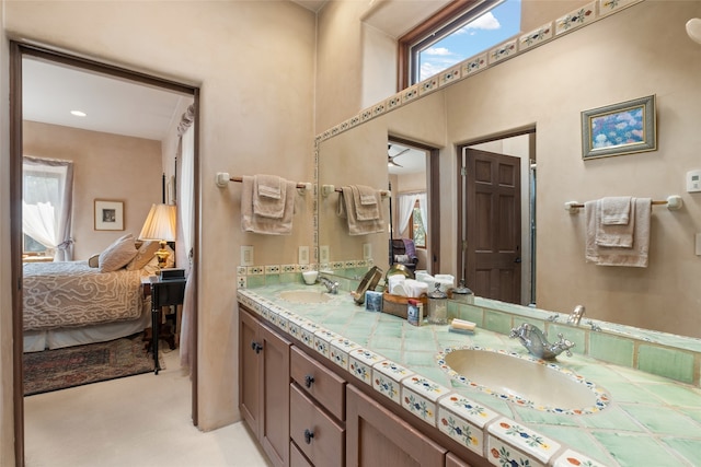 35 Sage Cir, Santa Fe, NM 87506 - bathroom featuring plenty of natural light, a sink, and connected bathroom