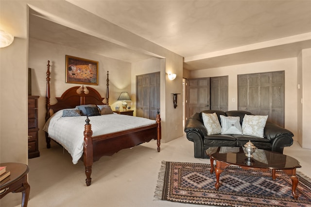 35 Sage Cir, Santa Fe, NM 87506 - bedroom with light colored carpet and multiple closets