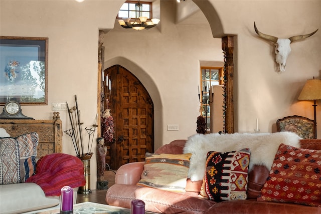 35 Sage Cir, Santa Fe, NM 87506 - living area featuring arched walkways and an inviting chandelier
