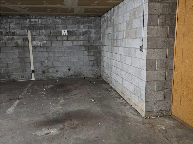 basement featuring concrete block wall