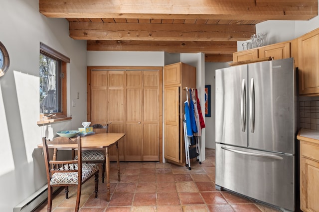 kitchen featuring freestanding refrigerator, beam ceiling, light brown cabinets, and wooden ceiling