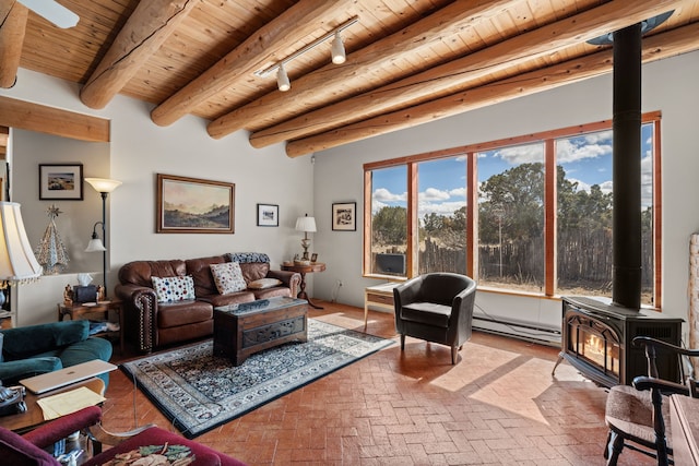living room featuring a wood stove, brick floor, a baseboard heating unit, and wooden ceiling