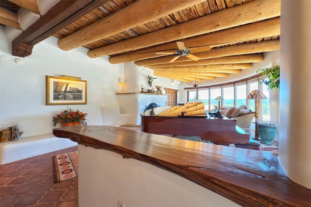 reception with ceiling fan and a large fireplace