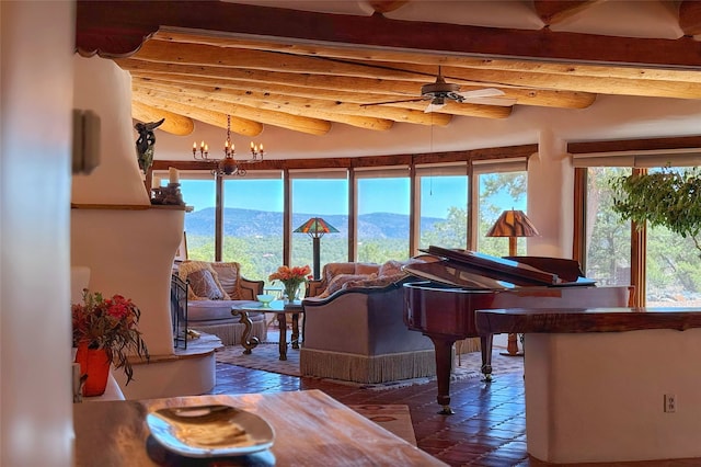 interior space featuring beamed ceiling and a mountain view