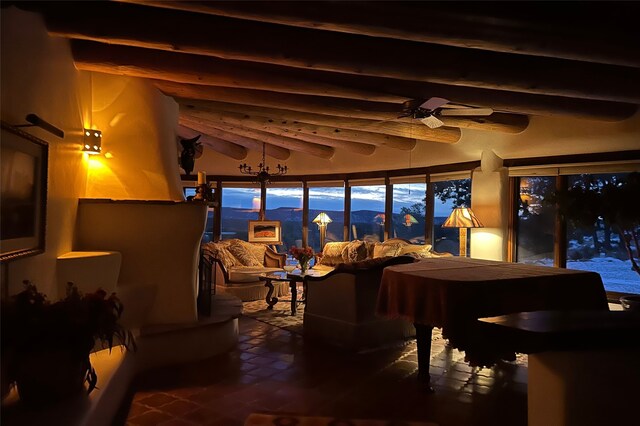 sunroom featuring beamed ceiling