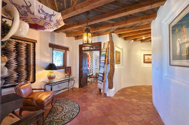 living area featuring beam ceiling