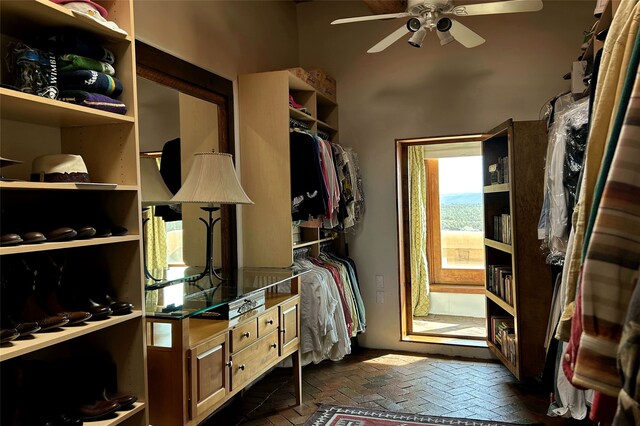 spacious closet featuring a ceiling fan