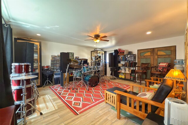 living area featuring recessed lighting, ceiling fan, and wood finished floors