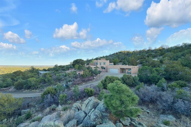 aerial view featuring a wooded view