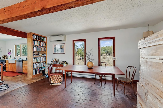 dining room with a textured ceiling, a wall unit AC, baseboard heating, and brick floor