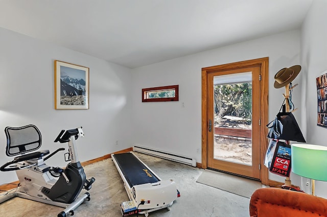 exercise area featuring baseboards and baseboard heating