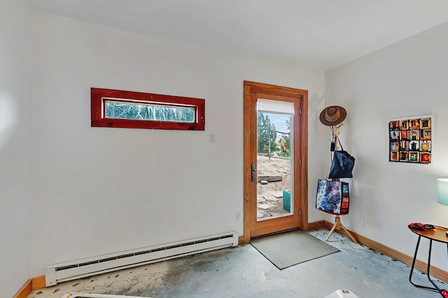 entryway with concrete flooring, baseboards, and a baseboard heating unit