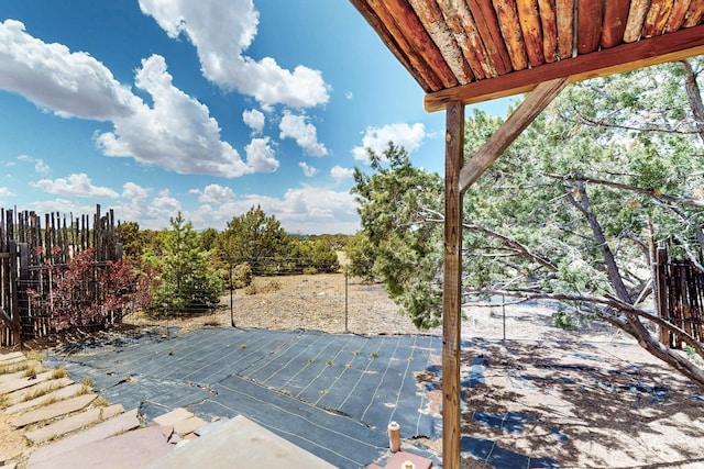 view of patio featuring fence