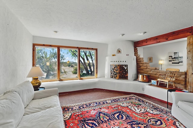 living area with a textured ceiling