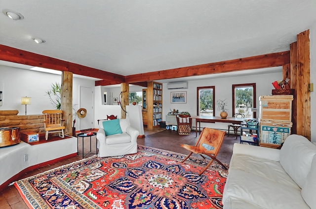 living room featuring wood finished floors, a baseboard heating unit, a wall unit AC, and beamed ceiling